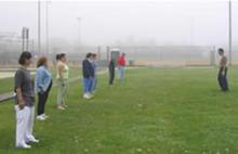 Tai Chi in the Park (May 2004): Guest facilitator Elan Abneri leads the mornings participants in some balance work on a very foggy morning.