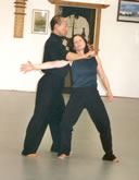 In the Kwoon, ABC T'ai Chi with Spencer Gee (February 2005): Mr. Gee demonstrating the use of a knife as a controlling tool with his student, Cathy Anastasio, during a T'ai Chi Applications seminar.