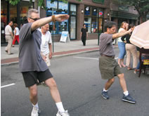 Village of Patchogue, Alive After Five (July 22, 2005): Laoshi Laurince McElroy (L) and Si-Hing Paul Adago, Jr., in High Pat on Horse from the WTS 24-Posture Form.