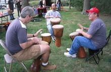 Little Portion Friary, Harvest Fair and Pet Blessing (September 30, 2006): The time between demonstrations and answering questions at the table allowed for other things. (L to R) John Davis, Joel Valerio, and Si-Hing Ed OConnell take advantage and form a small drum circle.