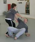 In the Kwoon, ABC T'ai Chi with Spencer Gee (May 2006): Patricia Hsieh (L) effectively demonstrates the power of coiling energy (Chan-si) by uprooting Laoshi Laurince McElroy.