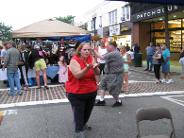 Village of Patchogue, Alive After Five (July 7, 2009): Water Tiger Students Mary Walsh (L) and Mark Williams (R) play The Monkey Offers the Fruit from the Five Animal Frolics while passers-by gawk and wonder.