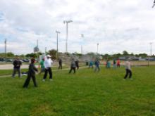 Tai Chi in the Park (June 3, 2017): Laoshi Laurince McElroy (R) leads the mornings participants through the four postures of Water Tigers Taste of the 24. 