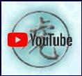 Tile of Chinese idiogram for "tiger" on blue water background with YouTube masthead.