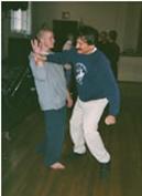 World T'ai Chi & Qigong Day; South Ocean Middle School Gymnasium, Patchogue NY (April 12, 2003): Water Tiger School student Matt Kintzel (L) experiencing Push Hands tutelage from workshop facilitator Bob Klein, Long Island School of T'ai-Chi-Chuan in Sound Beach.
