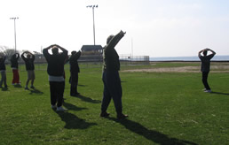 World Tai Chi & Qigong Day; Shorefront Park, Patchogue NY (April 24, 2004): Laoshi Laurince McElroy (R) kicks off the morning by serving participants some freshly squeezed organs courtesy of a T'ai Chi / Qigong Stretch.