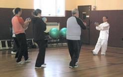 World Tai Chi & Qigong Day; St. Francis De Sales Parish Hall, Patchogue NY (April 30, 2005): Spencer Gee, Spencer Gee Wellness Corp. (R), leading participants in his T'ai Chi Workout.