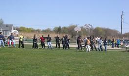 World Tai Chi & Qigong Day; Shorefront Park, Patchogue NY (April 29, 2006): Bob Klein (foreground / right in brown jacket), Long Island School of T'ai-Chi-Chuan, leading participants in a Yang-style Tai Chi workshop.