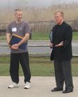 World Tai Chi & Qigong Day; Shorefront Park, Patchogue NY (April 28, 2007): The Honorable Jack Eddington, Suffolk County Legislation 7th District, speaks of the importance in setting a good wellness example for the youth of Suffolk County before presenting Laoshi Laurince McElroy with the Proclamation from the Suffolk County Legislature to acknowledge April 28, 2007, as World Tai Chi and Qigong Day.