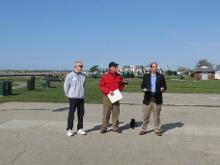 World Tai Chi & Qigong Day; Shorefront Park, Patchogue NY (April 28, 2012): (R to L)Robert Calarco, Suffolk County Legislature  7th District, with William Hilton, Village of Patchogue Commissioner of Parks & Recreation and Trustee, and Laoshi Laurince McElroy looking on, presents a Proclamation from the Suffolk County Legislature at the beginning of the morning. The proclamation acknowledges the 12th year of the event in Patchogue and health benefits of the Chinese arts. During his presentation, Legislature Calarco spoke to the importance of centering oneself through arts like Tai Chi and Qigong in these stressful times.