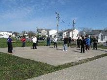 World Tai Chi & Qigong Day; Shorefront Park, Patchogue NY (April 28, 2012): Judith Budd-Walsh (L) from Harmonious Movement in Port Jefferson begins with Meridian Therapy and moved through Tibetan Breathing Qigong and the first third of her Yang-Style Long Form.