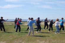 World Tai Chi & Qigong Day; Shorefront Park, Patchogue NY (April 27, 2013): Bob Klein (C - front) from the Long Island School of T'ai-Chi-Chuan of Sound Beach started the morning with How to Teach Tai Chi. Hes pictured here leading his second workshop focusing on Chen-style Tai Chi.