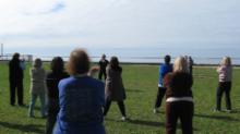 World Tai Chi & Qigong; Shorefront Park, Patchogue NY (April 30, 2016): Judith Budd-Walsh (C, facing toward), Harmonious Movement of Port Jefferson Station, brought the usual and popular mix to her workshop, including Tibetan breath and meridian therapy, plus an abbreviated version of her lineages Yang-style Long Form.