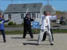 World Tai Chi & Qigong Day; Shorefront Park, Patchogue NY (April 30, 2016): The new kid on the block this year, Alan Sims (front) of New York City, leads his group in a some Torso Method Exercises as part of his mornings mixed workshop.