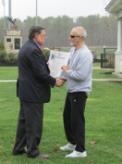 World Tai Chi & Qigong Day; Diamond in the Pines, Coram NY (April 28, 2018): Edward P. Romaine, Town of Brookhaven Supervisor (L), presents Event Coordinator Laurince McElroy, of Water Tiger School of Tai Chi Chuan in Medford (R), with both a letter-of-support from the Supervisors Office and a proclamation from the Brookhaven Town Council. Given this was our first year in the space, Mr. Romaine spoke to the fact that change can be a good thing and pointed out how the complex is in the center of the island and is blessed not only with plentiful parking, but also with a gorgeous surrounding grove of Long Island pine trees.