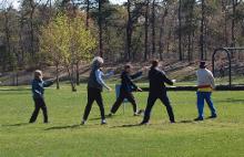 World Tai Chi & Qigong Day; Diamond in the Pines, Coram NY (April 27, 2019): Putting people through their paces, Joe Cronin (C  in black and blue jacket) of Bethpage, twists and turns through his  workshop focusing on the Primary Xiang Gong set and B. K. Frantzis Opening the Energy Gates.