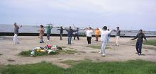 Tai Chi in the Park (May 20, 2006): Laoshi Laurince McElroy (L) leads the mornings rather wind-blown group in a walking exercise, Tai Chi Flying.