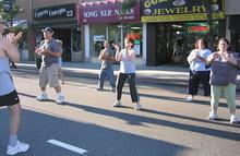Village of Patchogue, St. Jude Children's Research Hospital Fundraiser (August 18, 2006): Laoshi Laurince McElroy leading one passer by and Water Tiger students in the school's T'ai Chi Qigong Breathing Set for a Cause. (L to R) Laoshi, Si-Hing Ed O'Connell, unidentified passer-by, Joel Valerio, Si-Ji Francesca DeStefano, Mary Walsh, and April Alexander.