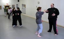 In the Kwoon, Exploring Tai Chi Chuan: Martially (January 2007): A small and very enthusiastic group of Tai Chi players from Water Tiger School and other South Shore Tai Chi programs enjoying some dynamic partnerships while exploring the Basic Postures / Basic Applications of Wave Hands Like Clouds and Parting the Wild Horses Mane at the first in a series of onsite seminars facilitated by McElroy Laoshi.