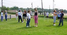 Tai Chi in the Park (May 26, 2007): The first session of the year draws to a close as the mornings large and diverse assembly playing with the concept of control-through-release with Water Tiger Schools Arm Drop exercise.
