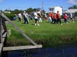 Tai Chi in the Park (August 18, 2007): The largest and most diverse group of the year embrace their fowl nature in the Crane Walking from the Five Animal Frolics with Laoshi Laurince McElroy (R) in the lead.
