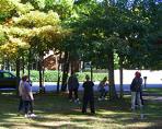 Out and About, Arbor Qigong (October 2007): Laoshi Laurince McElroy (at the tree) talks through the finer points and demonstrates Seeking the Root during the outdoor seminar held at a residential address in Medford on a very beautiful autumn day.