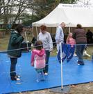 Camp Edey (Bayport), Girl Scouts of Suffolk County's GirlFest `08 (May 3, 2008): Si-Goo Mui Francesca DeStefano (L in light gray) and Laoshi Laurince McElroy (R in light gray) instruct mothers and their daughters in the broader points of Tai Chis redirection-of-force principle.