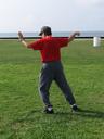 Tai Chi in the Park (August 16, 2008): As participants arrived for the first morning in the park this session, they are greeted by Si-Suk Paul Adago, Jr., playing Single Whip from the WTS Long Form.