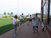 Tai Chi at Harborfront Park; Port Jefferson, NY USA (July 23, 2011): Laoshi Laurince McElroy (R) participates in his own workshop  Tai Chi Sword 101: Being One with the Weapon  to even out the partnerships.