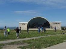 Tai Chi in the Park (June 21, 2014): During the unfolding on the morning of the summer solstice, the group explores the Yin and Yang of Brush Knee Strike in a rocking exercise while McElroy Laoshi circles the group to take photos  and make a correction here and there.