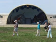 Tai Chi in the Park (August 16, 2014): A shot of about half this morning's "T'ai Chi in the Park" participants playing the Crane Walking from the Five Animal Frolics in front of the village's quite picturesque band shell.