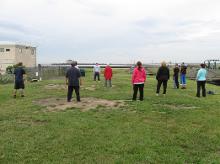 Tai Chi in the Park (June 6, 2015): To begin the morning, we had a guest presenter to warm up the crowd. Leading the group with some Shoulder Rolls is Ed Mahon (C - facing), a senior student in Water Tigers Sachem Public Library (Holbrook, NY USA) public class.