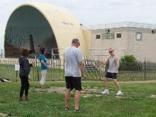 Tai Chi in the Park (June 27, 2015): Laoshi Laurince McElroy (R) leads the morning's  players in an introduction Ward-Off as part of Water Tiger's "Ball Variations" exercise.