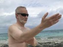 Smith's Reef on Providenciales, Turks & Caicos (March 9, 2018): In Ward-Off with the northern Caribbean beside him, McElroy Laoshi plays Water Tiger's Medium-Frame Yang-Style 24-Posture Form while vacationing in Paradise.