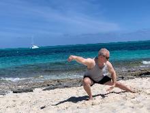 Smith's Reef on Providenciales, Turks & Caicos (March 12, 2019): Framed by white sand, exposed coral, and the crystal blue water of the Northern Caribbean, McElroy Laoshi continues his customl of playing Water Tigers Medium-Frame Yang-Style 24-Posture Short Form every morning while on holiday.