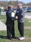 World Tai Chi & Qigong Day; Shorefront Park, Patchogue NY (April 29, 2006): The Honorable Jack Eddington, Suffolk County Legislation 7th District, presents Laoshi Laurince McElroy with the Proclamation from the Suffolk County Legislature to acknowledge April 29, 2006, as World Tai Chi and Qigong Day.