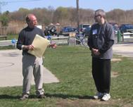 World Tai Chi & Qigong Day; Shorefront Park, Patchogue NY (April 29, 2006): William Hilton, Village of Patchogue Trustee and Commissioner of Parks & Recreation, presents Laoshi Laurince McElroy with a proclamation from the village's Mayor and Trustees recognizing the importance of local participation in the international event.