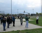 World Tai Chi & Qigong Day; Shorefront Park, Patchogue NY (April 26, 2008): Judith Budd-Walsh (at Right in white turtleneck), Harmonious Movement, puts people through the paces of one of many Qigong forms she taught throughout the opening hour of the morning.
