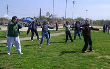 World Tai Chi & Qigong Day; Shorefront Park, Patchogue NY (April 26, 2008): Nancy Fiano (R), Dojo of the Dancing Dragon, leads while others follow through a mixture of Silk Reeling Exercises with a variety of Qigong.