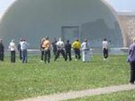 World Tai Chi & Qigong Day-; Shorefront Park, Patchogue NY (April 25, 2009): Bill Donnelly (C - facing out in black t-shirt) from Green Cloud Kung Fu of Holbrook, presents one Tai Chi posture, Snake Creeps Down, from three different perspectives  Qigong, physical exercise, and martial application.