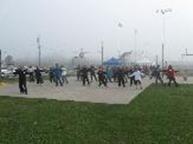 World Tai Chi & Qigong Day; Shorefront Park, Patchogue NY (April 25, 2009): Returning for her second year, Nancy Fiano (L) from Dojo of the Dancing Dragon in Lindenhurst added much to the mornings diversity with her presentation of the first set of Qigong Shibashi Exercises.