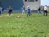 World Tai Chi & Qigong Day; Shorefront Park, Patchogue NY  (April 24, 2010): In recognition of the Year of the Tiger, Laoshi Laurince McElroy (C - in gray) of Water Tiger School led participants through a selection of the walks of the tiger from The Five Animal Frolics.
