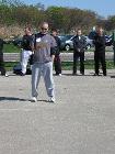World Tai Chi & Qigong Day; Shorefront Park, Patchogue NY (April 24, 2010):  Laoshi Laurince McElroy plays host and shares the recognition the event received in 2010 from Suffolk County Executive Steve Levy, the Village of Patchogue, and Ralph Macchio. For the second year, his comments were shared in Spanish. Water Tiger School student Patricia Hsieh (not pictured) served as interpreter for the formal remarks at the beginning of the morning and at the break.