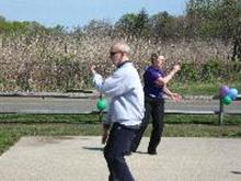 World Tai Chi and Qigong Day; Shorefront Park, Patchogue NY (April 28, 2012): Another view of the Facilitators' Demonstration (L-R) with Laoshi Laurince McElroy moving through Water Tiger's 24-Posture Yang-Style Form and Judith Budd-Walsh (Harmonious Movement) moving through the third section of her Yang-Style Long Form - a cutting she calls Fair Lady Works at Shuttles.
