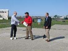 World Tai Chi and Qigong Day; Shorefront Park, Patchogue NY (April 28, 2012): William Hilton (C), Village of Patchogue Commissioner of Parks & Recreation and Trustee, with Robert Calarco (R), Suffolk County Legislature  7th District, looking on, presents Laoshi Laurince McElroy (L) with a Proclamation from the Honorable Paul V. Pontieri, Jr., Mayor of Patchogue, and the Village Board of Trustees. The proclamation acknowledges the health benefits of the Chinese arts and recognizes April 28th as World Tai Chi and Qigong Day in Patchogue. Mr. Hilton expressed the villages thanks for the annual event and for the work put forth by McElroy Laoshi on an annual basis.