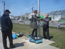 World Tai Chi & Qigong Day; Shorefront Park, Patchogue NY (April 28, 2012): Working with Water Tiger student Patricia Hsieh (C), Spencer Gee (R), Spencer Gee Wellness Corporation of Old Westbury, details balance and movement coordination using a variety of exercise tools and toys he brought with him.