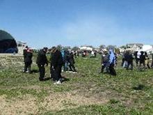 World Tai Chi & Qigong Day; Shorefront Park, Patchogue NY (April 28, 2012): Elan Abneri (3rd from L) from Zhang Style Tai Chi Chuan based in Centereach moves through his workshop helping participants with balance, alignment and rooting in static stances and in movement.