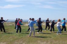 World Tai Chi & Qigong Day; Shorefront Park, Patchogue NY (April 27, 2013): Bob Klein (C - front) from the Long Island School of T'ai-Chi-Chuan of Sound Beach started the morning with How to Teach Tai Chi. Hes pictured here leading his second workshop focusing on Chen-style Tai Chi.