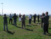 World Tai Chi & Qigong Day; Shorefront Park, Patchogue NY (May 3, 2014): With Fire Island on the horizon behind, Ed Turney (C - wearing burgundy over white) Shaolin Kung Fu Studios in Rocky Point, presents an outlook on QingChengShan Daoist alchemical methods, unification of Kan and Li (water & fire) with excerpts from some of the Chinese classics.