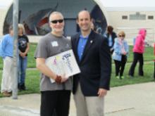 World Tai Chi & Qigong Day; Shorefront Park, Patchogue NY (April 29, 2017): Robert Calarco, Suffolk County Legislature  7th District (R), presents Event Coordinator Laurince McElroy, of Water Tiger School of Tai Chi Chuan in Medford (L), with a proclamation from the Suffolk County Legislature  our 11th from the distinguished body. We were pleased that Mr. Calarco echoed McElroy Laoshis earlier reference to the world-wide Peoples Climate March. 